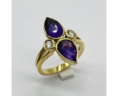 An amethyst and diamond ring set in 18ct gold