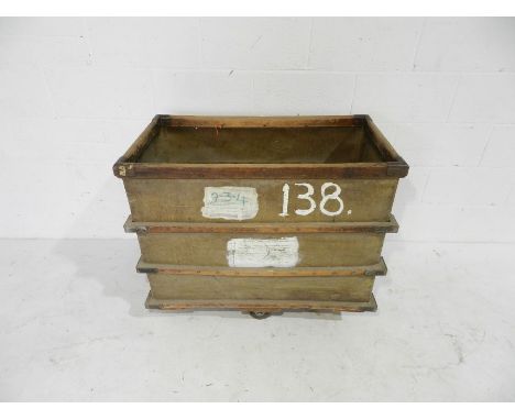 A small industrial bobbin trolley on wheels with wood bindings - from Axminster Carpets - length 90cm, depth 50cm, height 78c