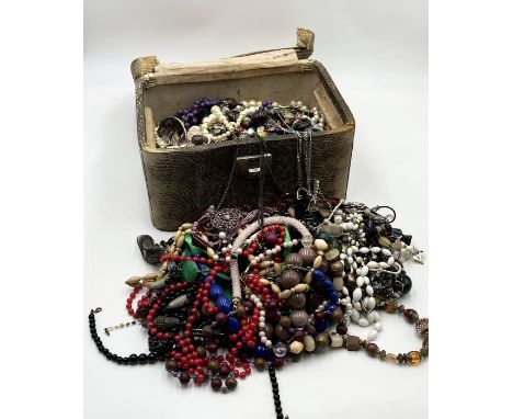 A large collection of vintage costume jewellery, beads etc.