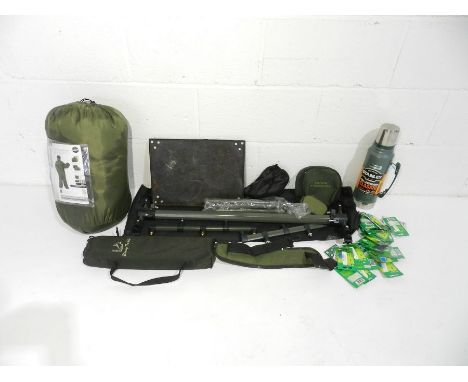 A quantity of camping and night fishing equipment including a Stanley flask, fishing sleep suit, light sticks etc.