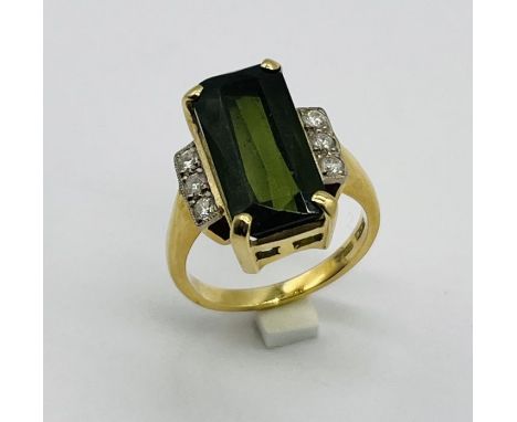 An 18ct gold tourmaline and diamond ring in the Art Deco style