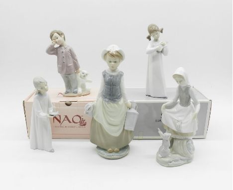 A quantity of Lladro figures including one boxed along with a boxed Nao figure