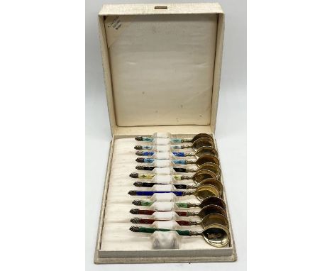 A cased set of 12 Norwegian K Hestenes Sterling 925 silver and enamel coffee spoons- slight damage to enamel on one spoon
