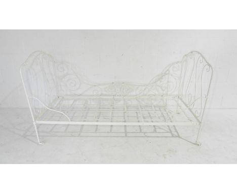 A vintage folding wrought iron day bed