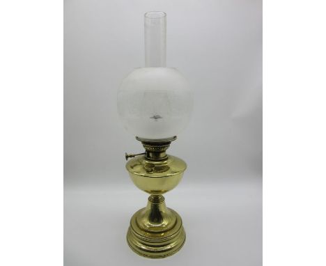 An early 20th century brass oil lamp- shade repaired