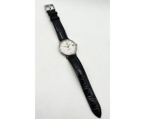 A vintage manual wind stainless steel Omega Seamaster with date aperture