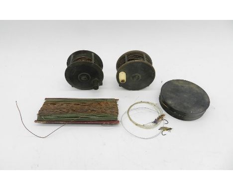 An antique fly fishing reel marked 'R Ramsbottom, Manchester' along with another marked 'P D Malloch, Perth', a fly tin with 