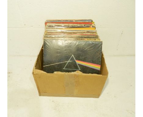 A quantity of 12" vinyl records including Pink Floyd, The Beatles, Black Sabbath, AC/DC, Elton John, Rod Stewart, Electric Li