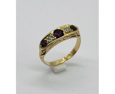 An 18ct gold diamond and ruby 5 stone ring