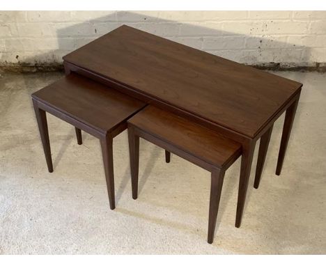 A Vintage mid century teak nest of three tables, each raised on square tapered supports H44cm, W85cm, D38cm