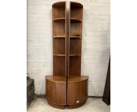 G-Plan - A pair of vintage teak bow front corner illuminated display stands, each with three open shelves over cupboard to ba