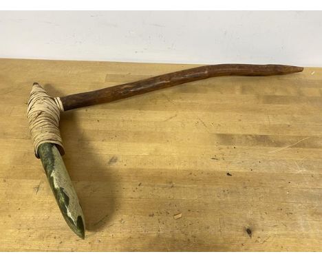 A Papua New Guinea adze with flat green stone blade, fibre binding on wooden handle (48cm x 29cm)