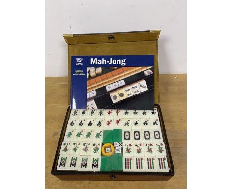 A Mahjong set, appears to be unused, with instruction booklet, produced in collaboration with the British Mahjong Association