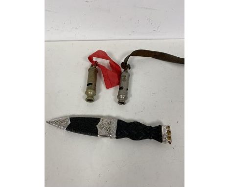 A mixed lot including a modern skean dhu (18cm), a policeman's whistle, inscribed The Metropolitan Police, Leith and another 