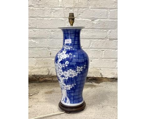 A modern blue and white ceramic table tamp on a circular hardwood base, H51cm (excluding shade bracket)