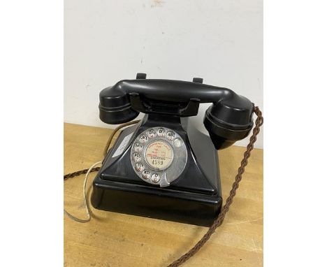 A vintage bakelite telephone, the rotary dial inscribed Granton (20cm)