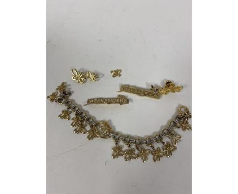 A chain link bracelet, the central panel marked 10k, with multiple butterfly charms (17cm) and two Weekenders bar brooches, o