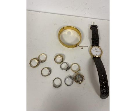 A mixed lot of jewellery including an early 20thc hinged bangle marked 59ct m/cor S&amp;K, a yellow metal ring set three diam