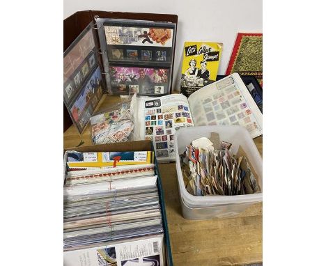 Stamp interest:  a stamp album with world stamps, First Day covers, a quantity of loose stamps (a lot)