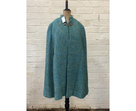 Barnat Klein - a flared panel design 1960's cape of turqouise and moss green checkered woven wool fabric with blue satinized 