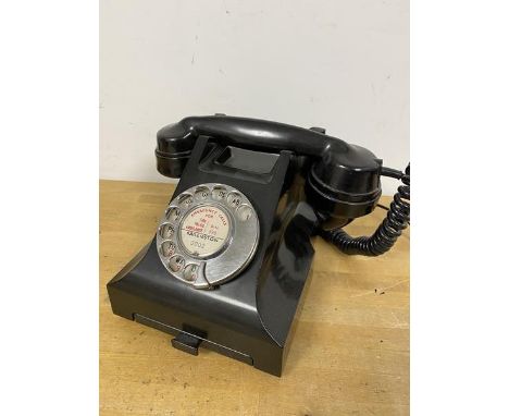 A vintage bakelite cased GPO telephone, register inscribed Baillieston (h.15cm)