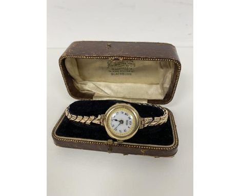 A lady's wristwatch, case marked 375, the dial inscribed IMSHI, with a rolled gold strap with vintage jewellery box from Ains