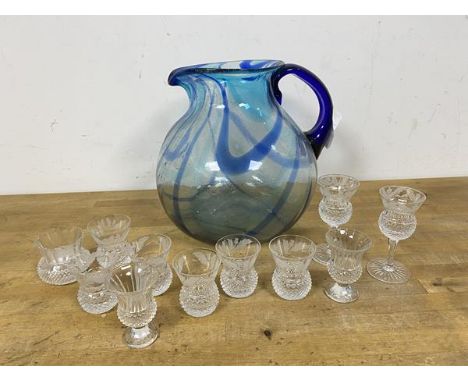 A  glass water pitcher of squat form (20cm), a group of thistle style whisky measures (a lot)