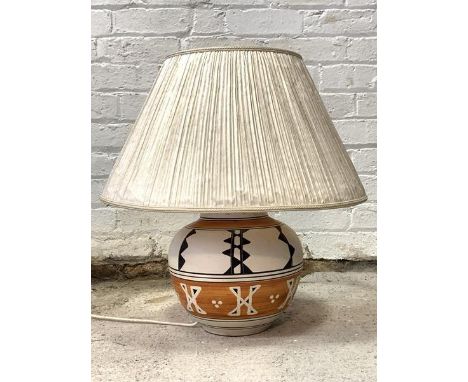 A Contemporary white black and terracotta painted ceramic table lamp of baluster form, together with a decorative lamp shade,
