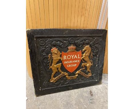 An ebonised wooden panel bearing the coat of arms for the Royal Insurance Group (47cm x 55cm)
