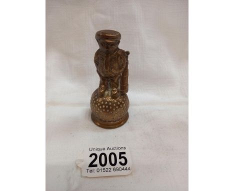 An undrilled Dunlop Caddy on golf ball car mascot/paperweight.