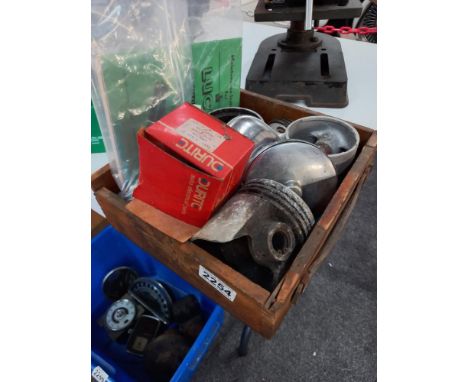 A box of engine parts including pistons, boxed Durite ammeter, Pitmans book of the ariel leader &amp; arrow &amp; Lucas light