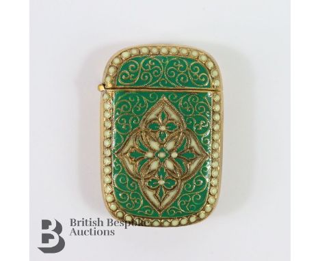 Brass cased vesta with green enamel, approx 40 x 30 mm.