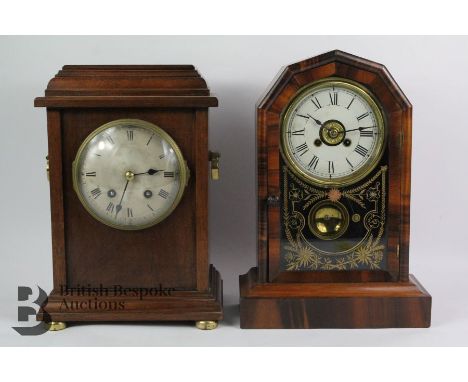 An oak mantel clock, having a silvered face with Roman dial, French movement strikes to a coil, nr 68851, complete with windi