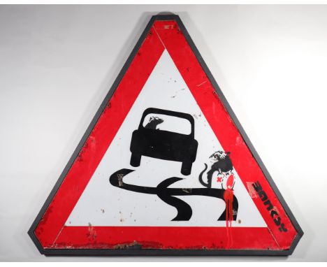  Banksy. â€œRevenge of the toxic ratâ€ Black and red spray on a road sign, representing a monkey that spills a toxic product 