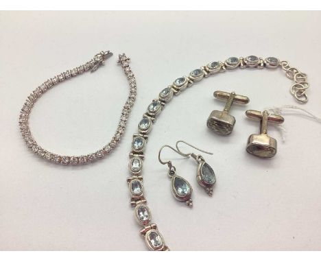 A Modern Stone Set Tennis Style Bracelet, the round stones claw set throughout, to push clasp with safety clip, stamped "925"