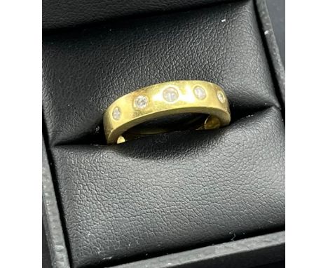 18ct yellow gold ring set with five round cut diamonds. [Ring size O] [5.88Grams] 