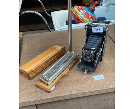 Vintage Coronet bellow camera and Hohner Harmonica 