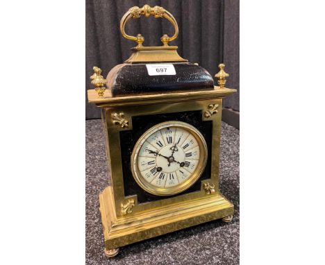 Antique 19th century heavy gilt brass and black leather mantel clock. Roman numerals on white enamel face. Comes with a pendu