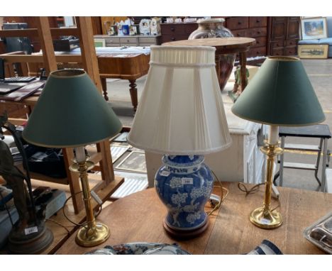 Two brass table lamps and blue and white Chinese blossom design table lamp 