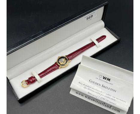 Ladies WM of Switzerland Golden Skeleton wrist- watch with 17 Jewel skeleton type mechanical movement, with see through front