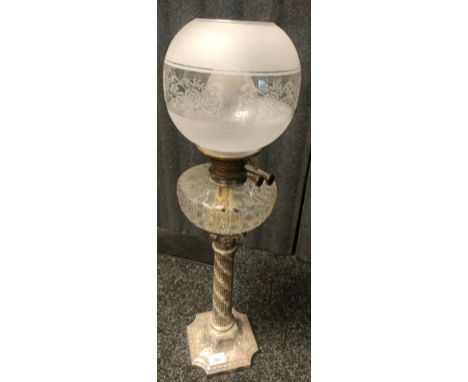 A Large 19th century Corinthian column paraffin lamp, crystal etched paraffin holding area and frosted and acid etched shade.