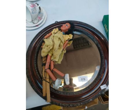 Antique moulded round framed mirror and pelham puppet 