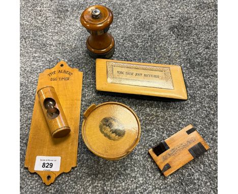 A Selection of Mauchline ware to include the Albert Egg timer, bucket thread dispenser, Games counter, Pepper pot and Hat cle