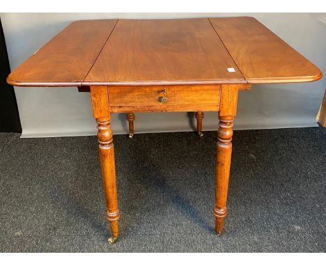 19th century mahogany drop end sofa table, the rectangular top raised on turned legs ending in brass castors. [76x102x105cm] 