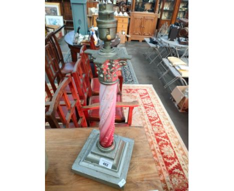 Antique paraffin lamp base converted to electric. 