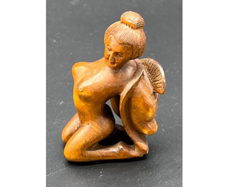 Japanese hand carved boxwood netsuke sculpture of a nude geisha figure. Signed. 