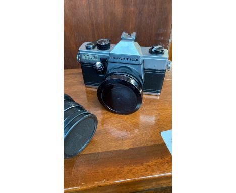 Praktica camera, lenses and carry bag together with a pair of Omiya binoculars 