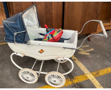 Vintage Churchill dolls pram together with a Chad Valley spinner top. 