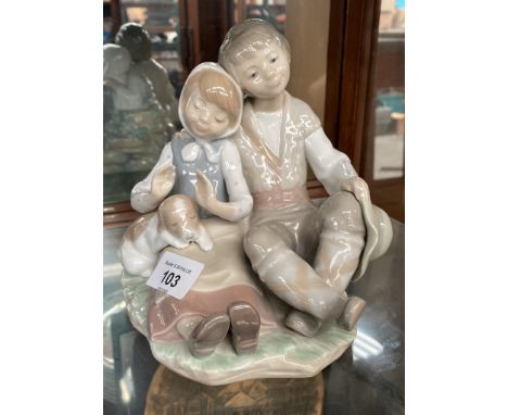 Lladro Boy, girl and puppy figurine. 