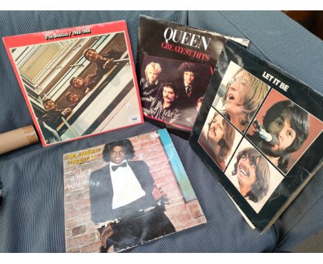 A Lot of four vintage records includes The Beatles, Queen and Michael Jackson 